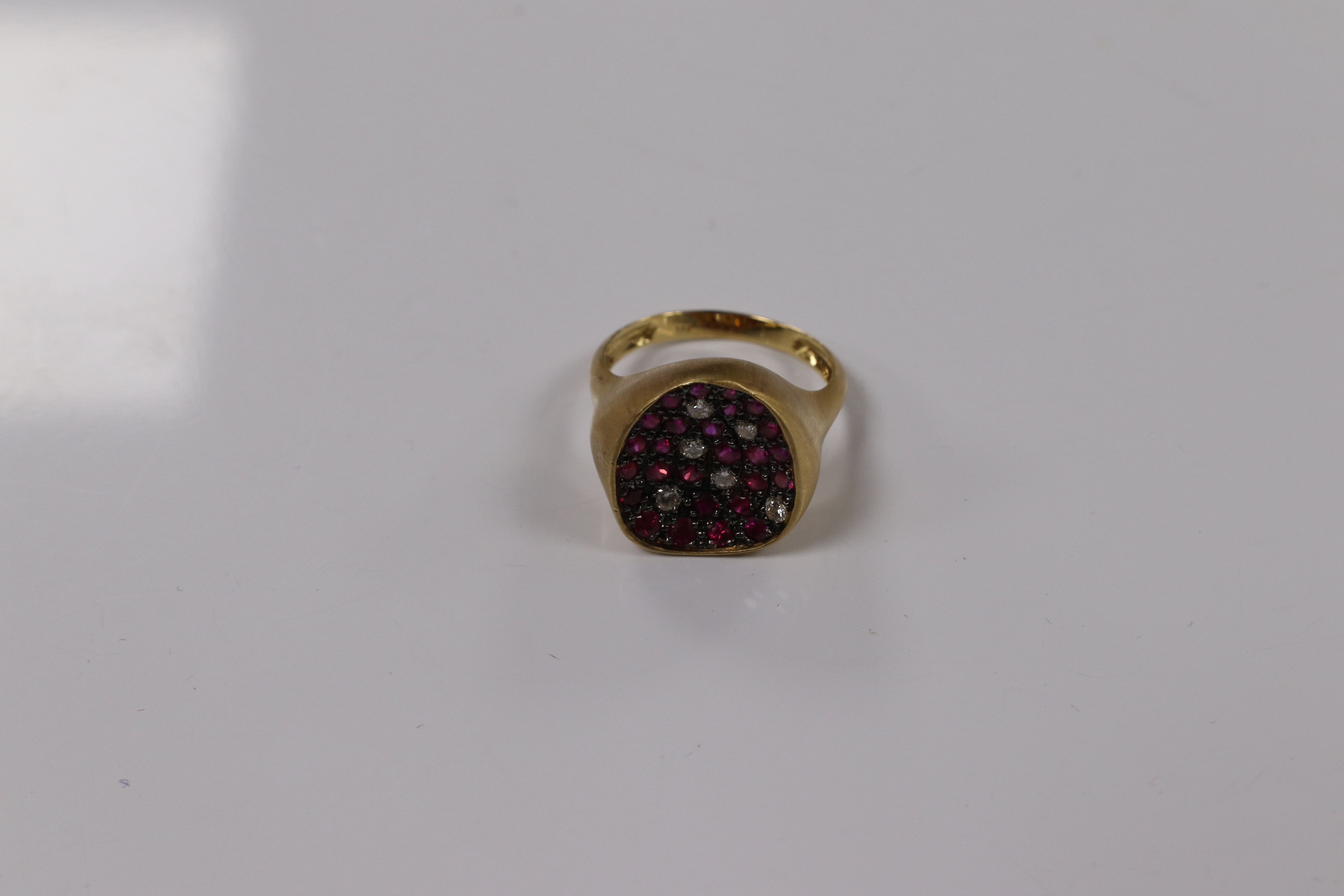 A modern 18k and pave set ruby and diamond set concave dress ring, size O, gross weight 5.4 grams. Condition - fair